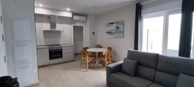 a living room with a couch and a table at Guesting Hospital in Cádiz