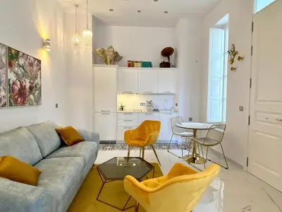 a living room with a couch and a table at innCádizCasa Señorial Rivadavia in Cádiz