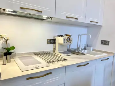 a kitchen with a sewing machine on a counter at innCádizCasa Señorial Rivadavia in Cádiz