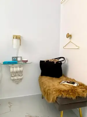 a room with a furry chair with a purse on it at innCádizCasa Señorial Rivadavia in Cádiz
