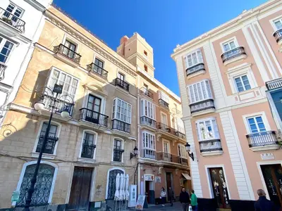 a group of buildings with people walking in front of them at innCádizCasa Señorial Rivadavia in Cádiz