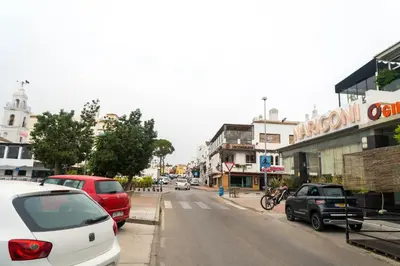 a street with cars parked on the side of the road at R&B Vistahermosa Views in El Puerto de Santa María