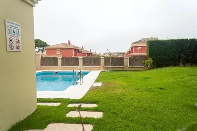 a backyard with a swimming pool in a yard at R&B Vistahermosa Views in El Puerto de Santa María