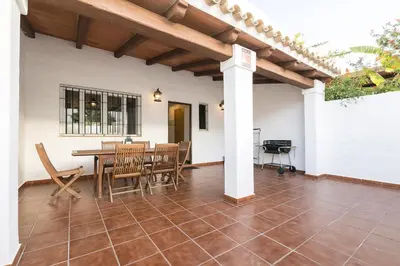 a dining room with a table and chairs at Duplex Near the Beach in Chiclana de la Frontera