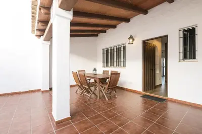 a dining room with a table and chairs at Duplex Near the Beach in Chiclana de la Frontera