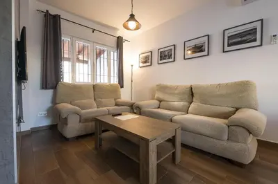 a living room with two couches and a coffee table at Duplex Near the Beach in Chiclana de la Frontera