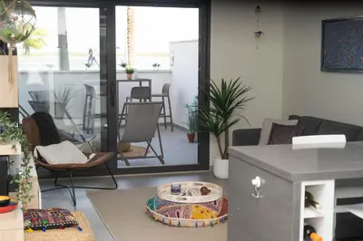 a living room with a couch and a table at Arenas de Sanlúcar in Sanlúcar de Barrameda
