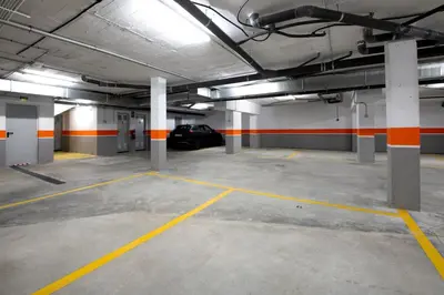 an empty parking garage with a car parked in it at Arenas de Sanlúcar in Sanlúcar de Barrameda