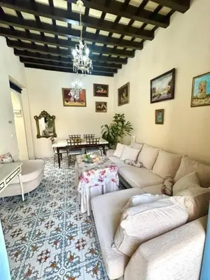 a living room with two couches and a table at GATU Casa Lola , 