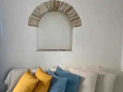 a kitchen with a sink and a washing machine at Casa del Olivo by Casitasconencantoes in Medina Sidonia