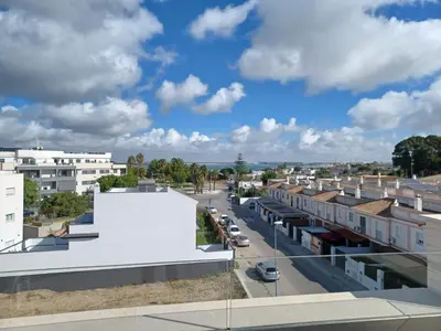 an aerial view of a city with buildings at Atico Costa Doñana in Sanlúcar de Barrameda