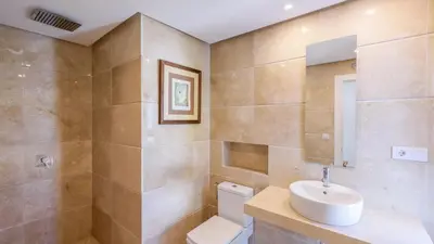 a bathroom with a white sink and a toilet at Villa con Encanto Conil de la Frontera by Ruralidays in Conil de la Frontera