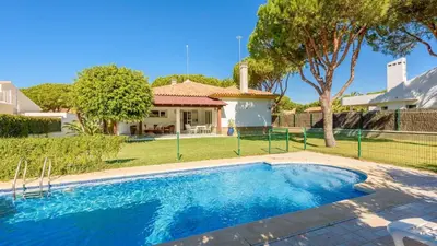 a swimming pool in front of a house at Villa con Encanto Conil de la Frontera by Ruralidays in Conil de la Frontera