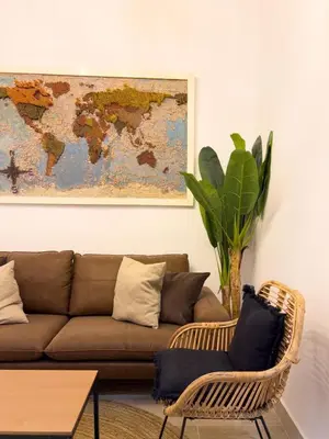 a living room with a couch and a table at El Destino Corazón de Cádiz Grupo AC Gestion in Cádiz