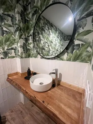 a bathroom with a sink and a mirror on a counter at Loft Deluxe Herrería 6 - Vivienda Vacacional. in El Puerto de Santa María