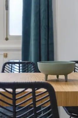 a bowl sitting on top of a wooden table at SERENISSIMA Apartment by Cadiz4Rentals in Cádiz