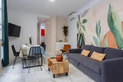 a living room with a couch and a table at SERENISSIMA Apartment by Cadiz4Rentals in Cádiz