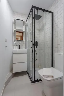 a bathroom with a shower and a toilet and a sink at SERENISSIMA Apartment by Cadiz4Rentals in Cádiz