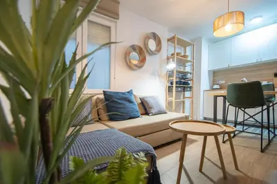 a living room with a couch and a table at Apartamento La Habanera de Cadiz in Cádiz