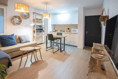 a living room with a couch and a table at Apartamento La Habanera de Cadiz in Cádiz