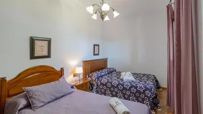 a bedroom with two beds and a lamp at Villa Brenda Conil de la Frontera by Ruralidays in Conil de la Frontera