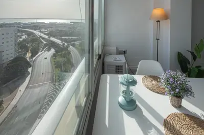 a room with a window with a view of a highway at Apartamento La Atalaya de Cádiz in Cádiz