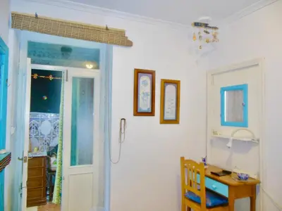 a room with a bathroom with a door and a desk at Habitaciones La Pepa in Cádiz