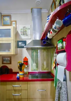 a toy kitchen with a red counter top at Habitaciones La Pepa in Cádiz