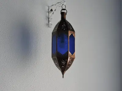 a blue glass object hanging on a wall at Hotel La Fonda del Califa in Arcos de la Frontera