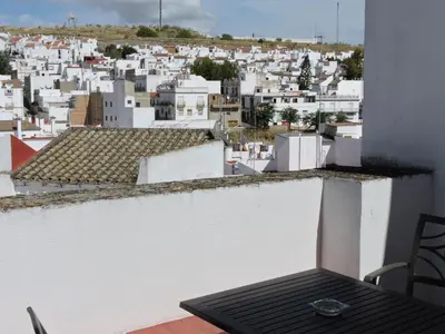 a view of a city from the balcony of a building at Hotel La Fonda del Califa in Arcos de la Frontera