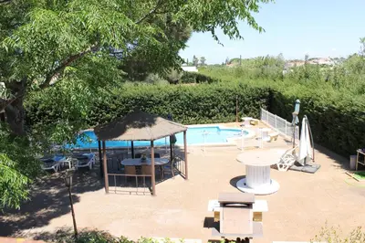 a patio with a gazebo and a swimming pool at Casa con Piscina Privada y Barbacoa en Chiclana Capacidad hasta 10 personas in Chiclana de la Frontera