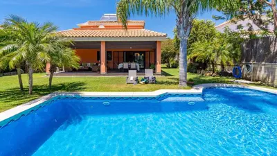 a swimming pool in front of a house at Villa Italia Conil de la Frontera by Ruralidays in Conil de la Frontera
