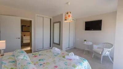 a living room with a couch and a table at Villa Mónaco Conil de la Frontera by Ruralidays in Conil de la Frontera