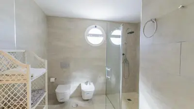 a bathroom with a shower and a toilet and a sink at Villa Mónaco Conil de la Frontera by Ruralidays in Conil de la Frontera