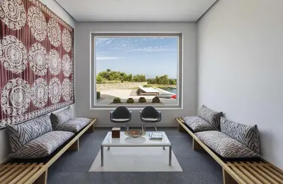 a living room with two couches and a large window at Cortijo exclusivo rodeado de un olivar centenario in Arcos de la Frontera
