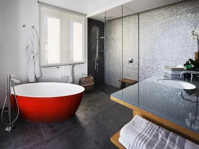 a bathroom with a red bath tub and a sink at Cortijo exclusivo rodeado de un olivar centenario in Arcos de la Frontera