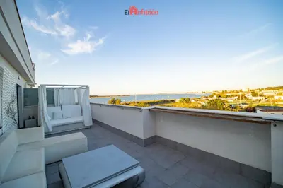 a balcony with a toilet and a view of the ocean at El Anfitrión - Barra del río in Sanlúcar de Barrameda