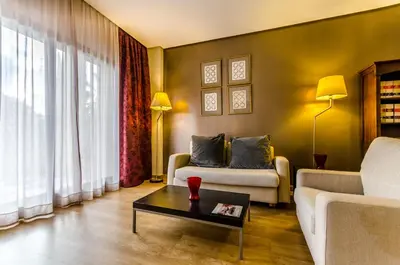a living room with a couch and a coffee table at Exe Guadalete in Jerez de la Frontera
