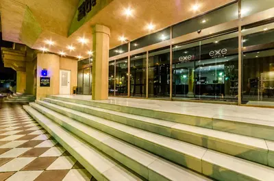 an empty lobby of a building at night at Exe Guadalete in Jerez de la Frontera