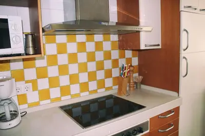 a kitchen with a counter top with a sink at PENTHOUSE WITH LARGE TERRACE IN CENTER OF CÁDIZ in Cádiz