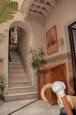 a room with a staircase and a stair case at PENTHOUSE WITH LARGE TERRACE IN CENTER OF CÁDIZ in Cádiz