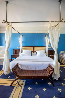 a bedroom with a bed with a canopy at Soho Boutique Vistahermosa in El Puerto de Santa María