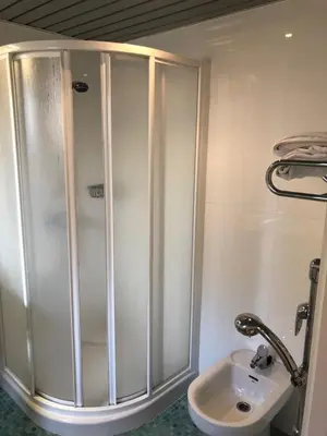 a bathroom with a shower and a toilet and a sink at Soho Boutique Vistahermosa in El Puerto de Santa María