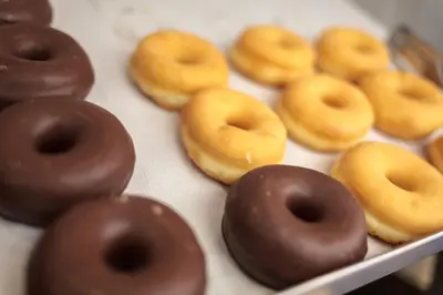 a group of donuts sitting on top of a box at Hotel Salymar in San Fernando