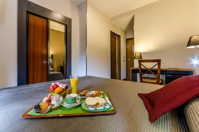 a tray of breakfast food on a table at Hotel Regio Cádiz in Cádiz