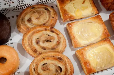 a box filled with different types of pastries at Hotel Los Olivos in Arcos de la Frontera
