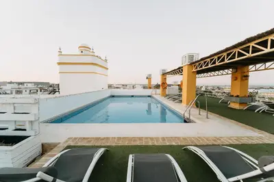a swimming pool on the roof of a cruise ship at Soho Boutique Puerto in El Puerto de Santa María