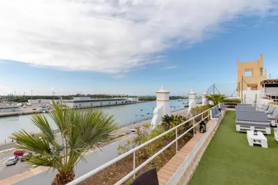a view of the water from the balcony of a building at Soho Boutique Puerto in El Puerto de Santa María