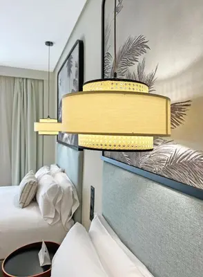 a hotel room with a bed and two tiers at Soho Boutique Puerto in El Puerto de Santa María