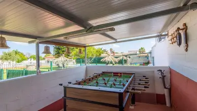 a room with a foosball table on a patio at Los Arcángeles Chiclana de la Frontera by Ruralidays in Chiclana de la Frontera